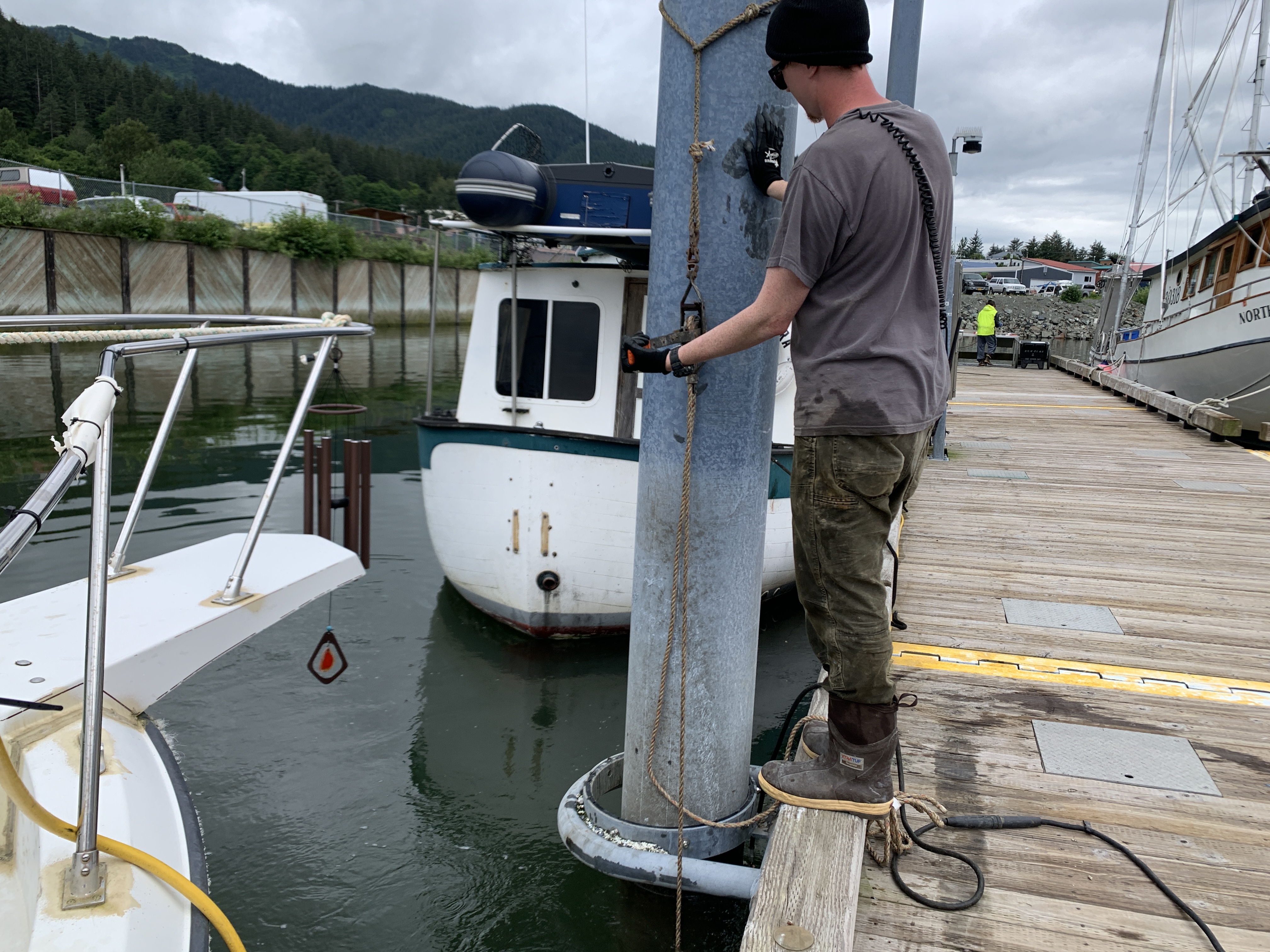 Global diving crew installing anodes on pile.