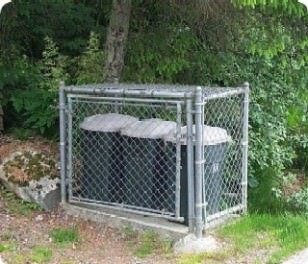 Chain link fence and steel post enclosure.