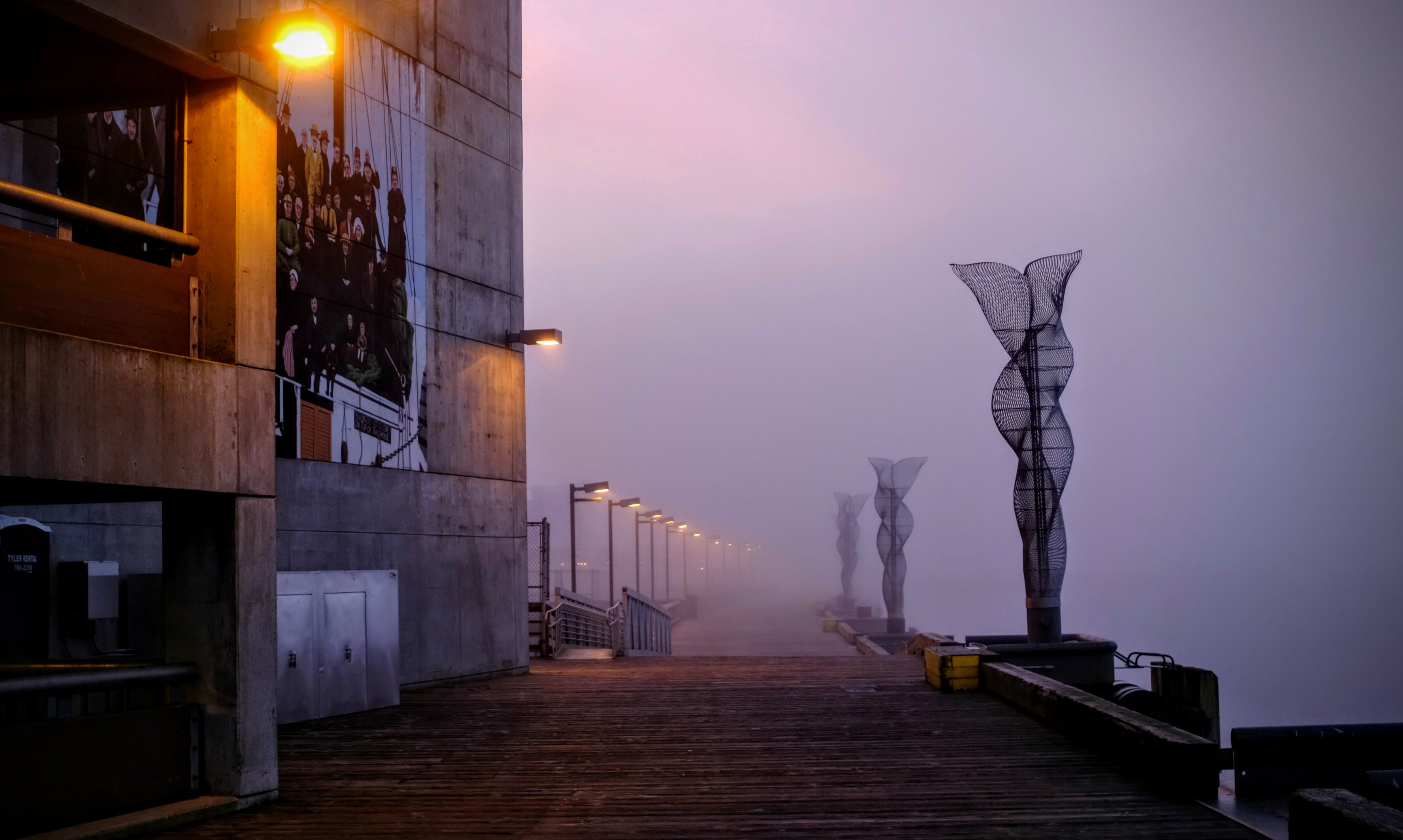 Foggy view of the west wall of the Downtown Library and the cruise ship pier.