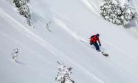 Photo of downhill skier on the slopes
