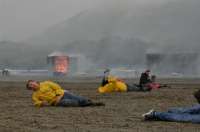 This is an image of volunteers laying on the ground role-playing as injured passengers during a previous emergency exercise at the Juneau International Airport.