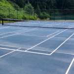 This is a picture of a tennis court with temporary pickleball lines.