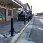 This picture shows bollards being installed on South Franklin Street.