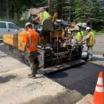 This is a picture of a work crew paving on Douglas Highway.