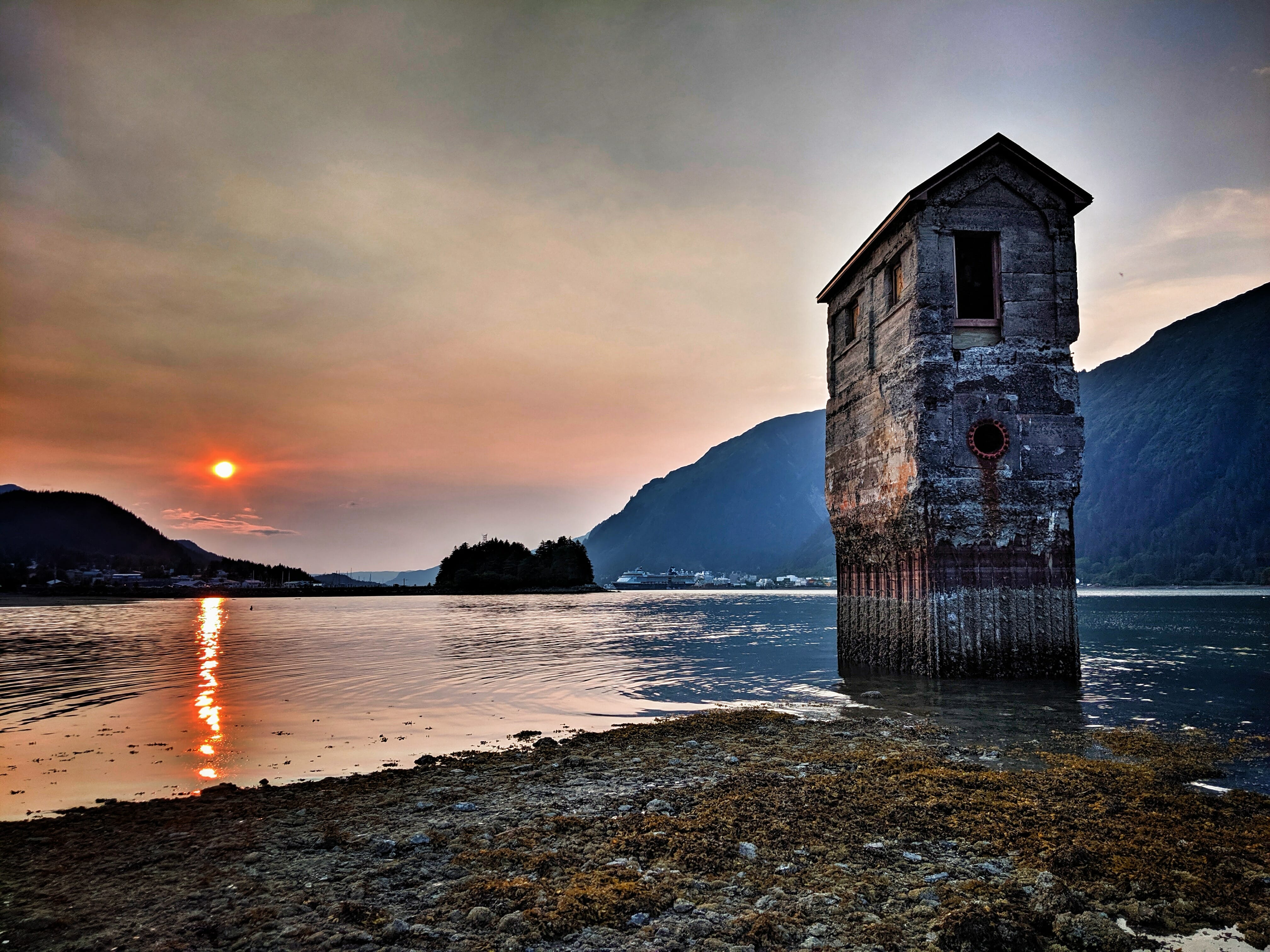 The old pump house at sunset at Sandy Beach