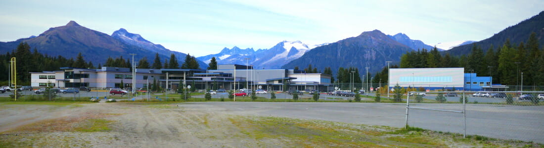 View of Thunder Mountain High School and mountains from Dimond Park
