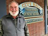 This is a picture of Housing Housing and Homelessness Services Coordinator Jesse Perry outside City Hall.