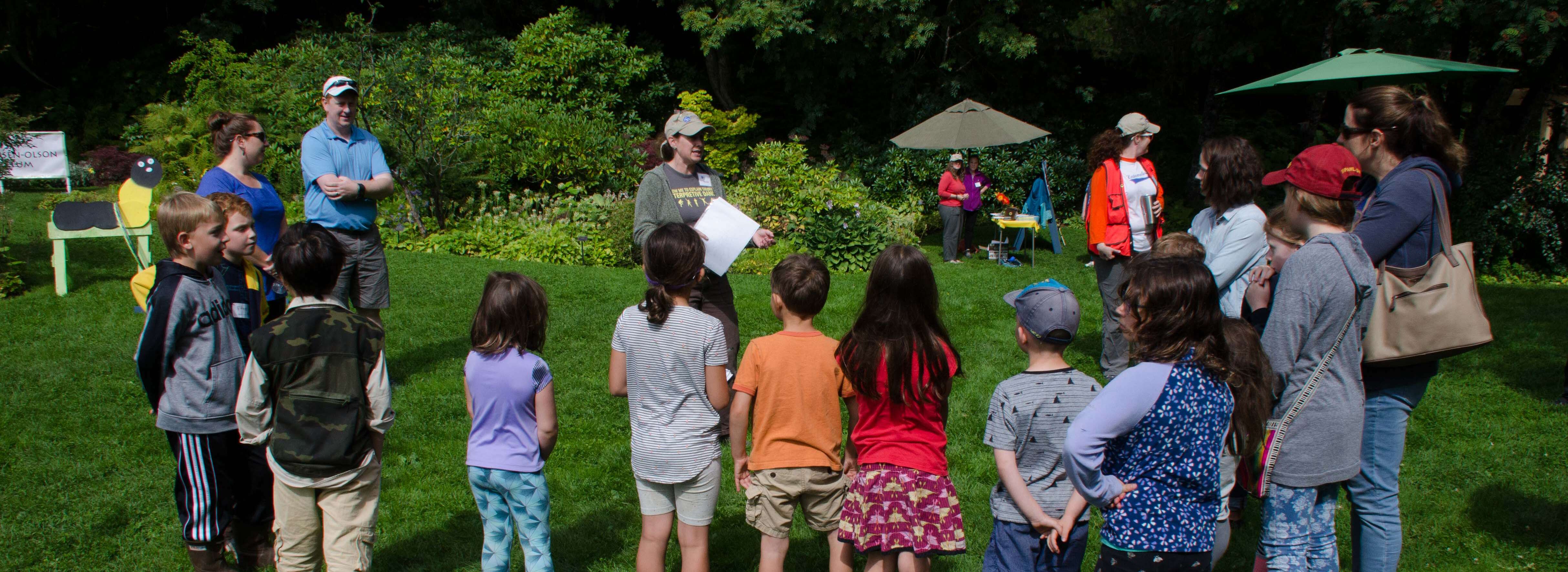 Kids gathered around on the lawn for Bug Day! at the Arboretum.