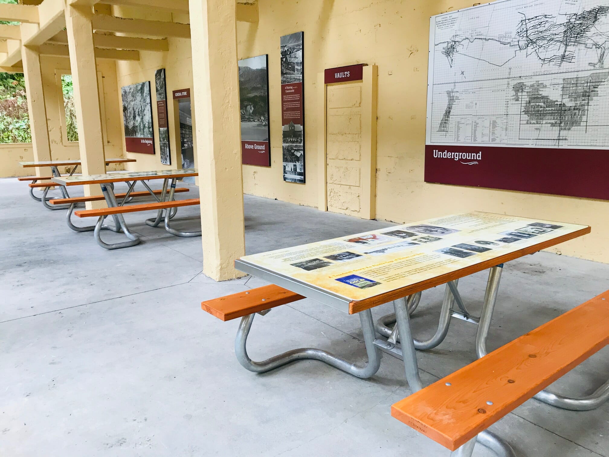Interpretive signs and picnic tables at historic Treadwell Office Building