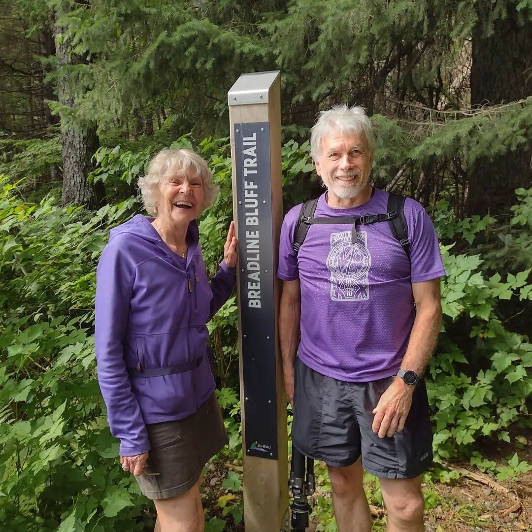 Two Walk Southeast 2021 participants at the Breadline Bluff trailhead marker