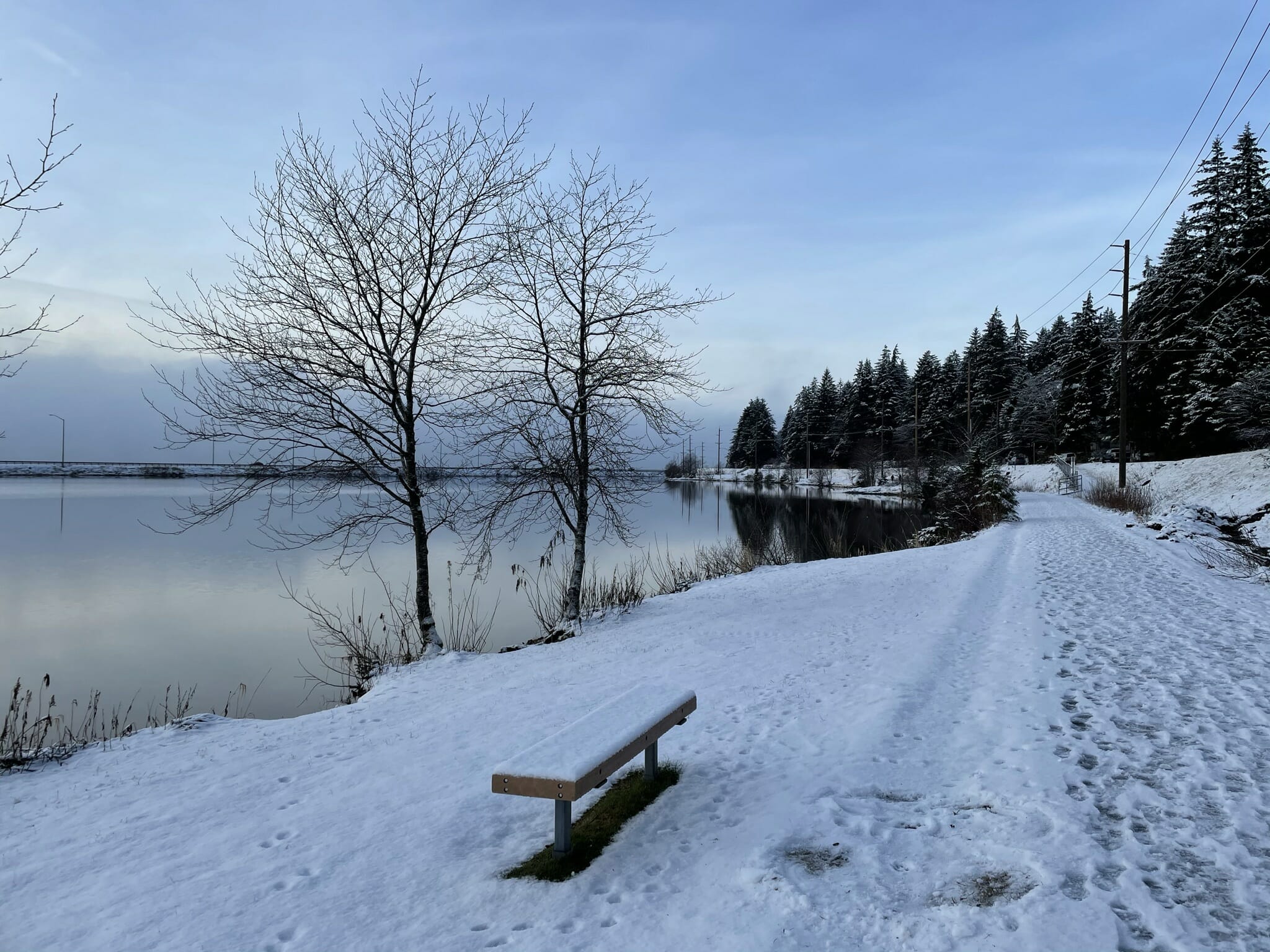 The snow covered path on a winter morning at Twin Lakes Park.
