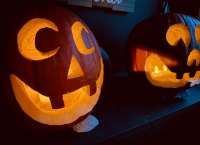 Photo of grinning carved Halloween pumpkins