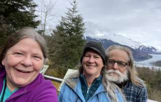 Three Walk Southeast 2022 participants selfie with Mendenhall Glacier in the background.