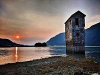 Photo of a sandy beach at sunset with the pump house in the foreground