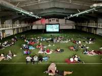 Photo of children watching a movie inside the Field House
