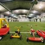 Photo of Dimond Park Field House turf with array of children's toys ready to play with