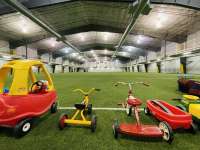 Photo of Dimond Park Field House turf with array of children's toys ready to play with