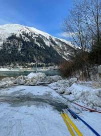 Photo of hoses from wastewater lift station discharging small stream of liquid