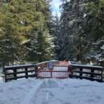 Photo of Montana Creek bridge in heavy snow closed off by barrier