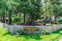 Photo of playground equipment with sign reading Sigoowu Ye Park - 