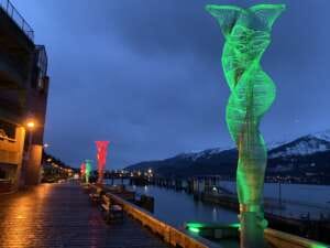 Photo of seawalk aquilean sculptures lit up in red and green