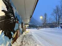 Photo of City Hall mural and snowy street