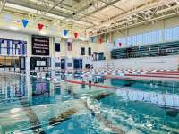 Photo of DPAC main pool interior including scoreboard and bleachers