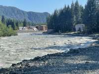 The Mendenhall River running high on a sunny day