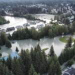 Aerial view of Mendenhall River with surrounding streets flooded