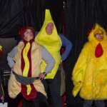 Skaters dressed as a hot dog, a banana, and a chicken pose for the camera