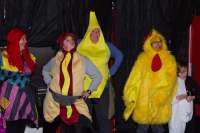 Skaters dressed as a hot dog, a banana, and a chicken pose for the camera