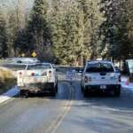 Maintenance trucks and a Road Closed sign block access to Skater's Cabin Road.