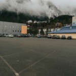 Wide view of the Whittier parking lot with Zach Gordon Youth Center building visible in the background