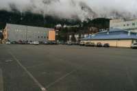 Wide view of the Whittier parking lot with Zach Gordon Youth Center building visible in the background