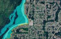 Map of projected inundation levels at 16 feet, showing HESCO barriers successfully limiting inundation