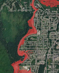 Aerial photograph with highlighted flood zone along Mendenhall River.