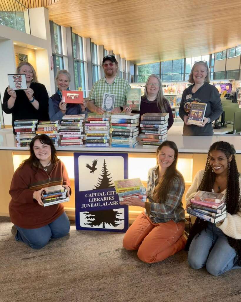 Library staff1 Staff with books at the valley library