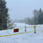 Snowy Kaxdigoowu Heen Dei (Brotherhood Bridge Trail) with closure signage.