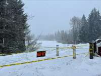 Snowy Kaxdigoowu Heen Dei (Brotherhood Bridge Trail) with closure signage.