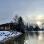 Cabin at the edge of Twin Lakes on a winter day.