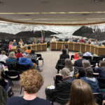 Juneau residents pack the Assembly Chambers for a public hearing.