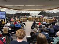 Juneau residents pack the Assembly Chambers for a public hearing.