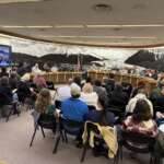 Community members fill the Assembly Chambers.