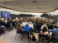 Community members fill the Assembly Chambers.