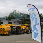TNS_2025-35 Month of Play flag in front of trucks at Thunder Mountain Middle School.